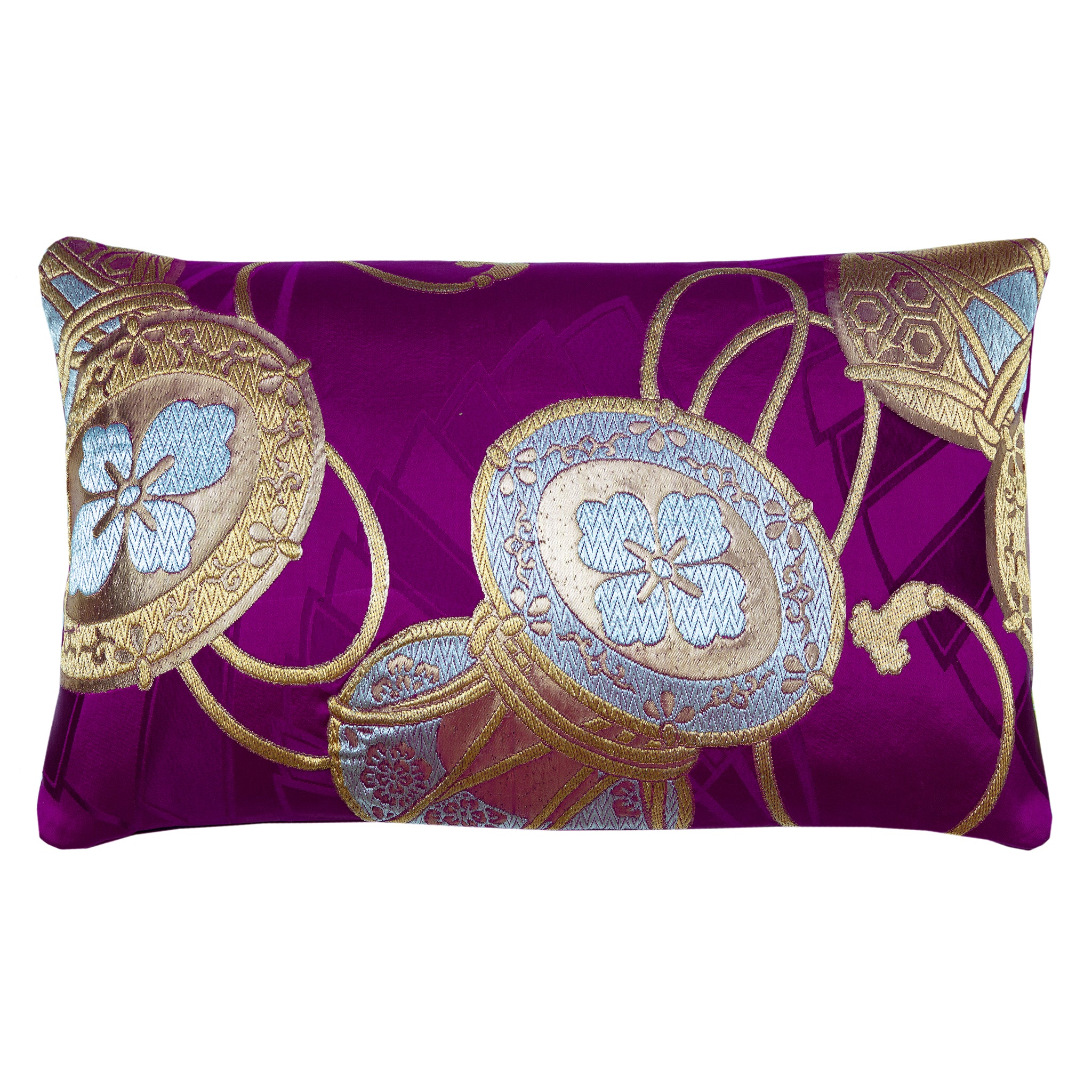 Rectangular purple silk obi cushion with metallic gold drums over purple woven fans.