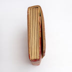 Side view of metallic gold Japanese silk envelope clutch