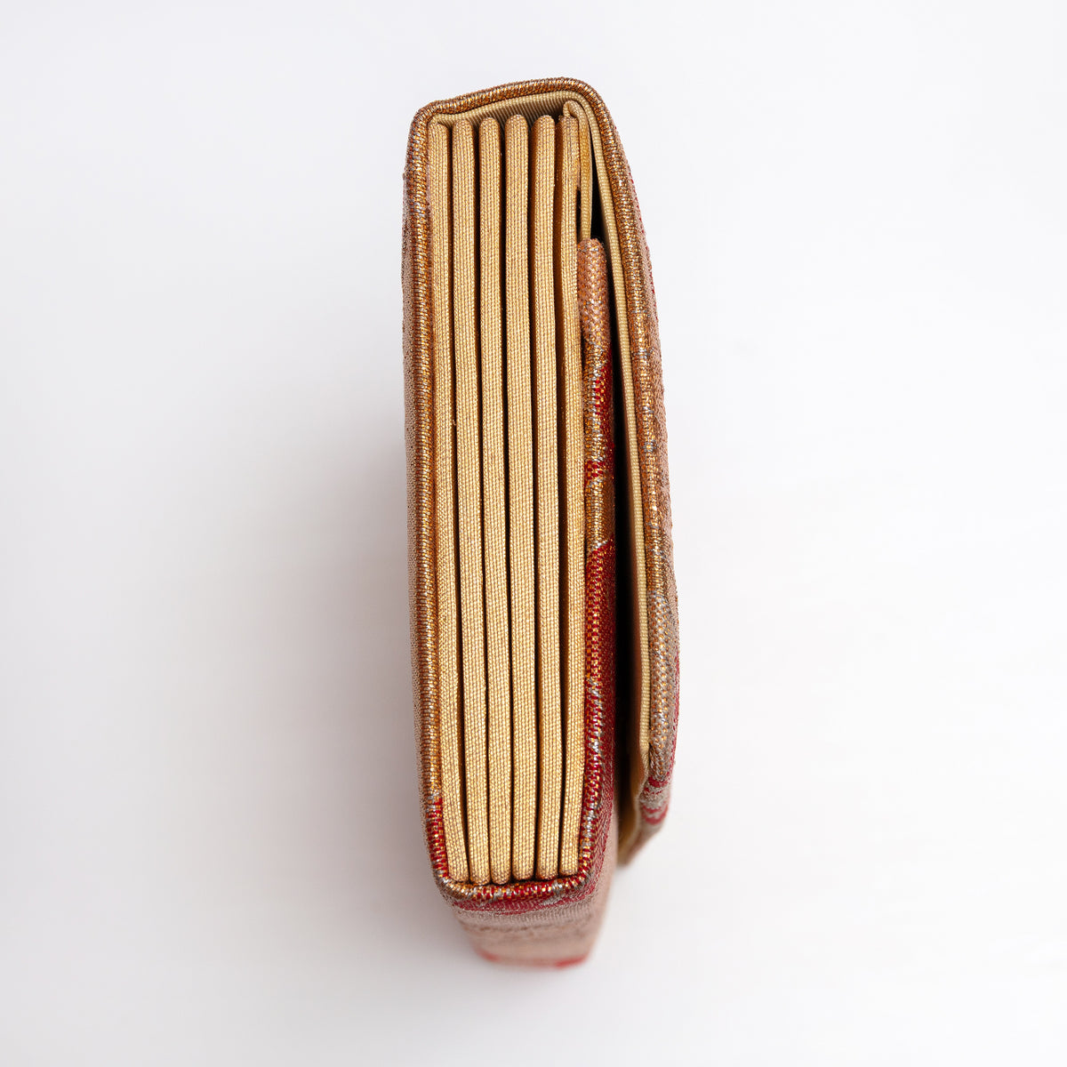 Side view of metallic gold Japanese silk envelope clutch