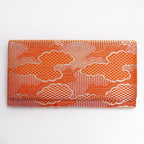 Orange and gold Japanese silk foldover clutch with graphic cloud design