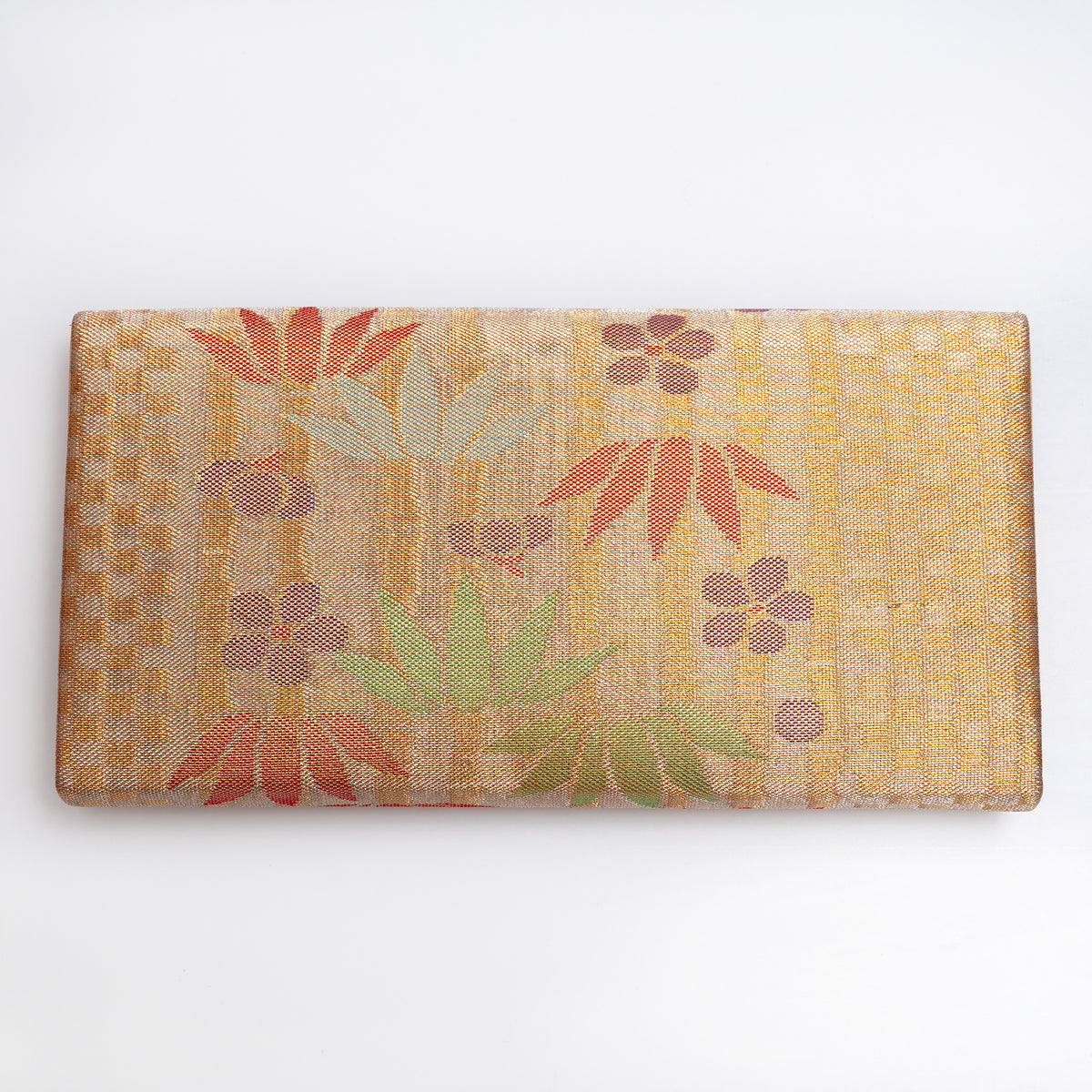 Back of metallic bronze-gold vintage Japanese silk clutch showing small upper-centre mark