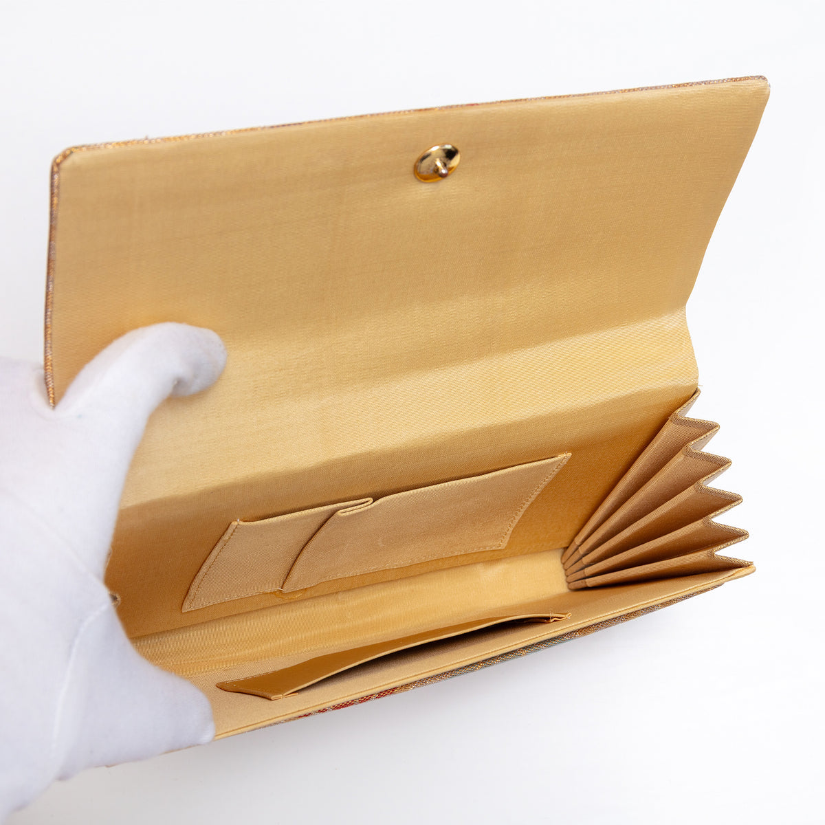 Butter silk interior with two pockets inside vintage Japanese clutch