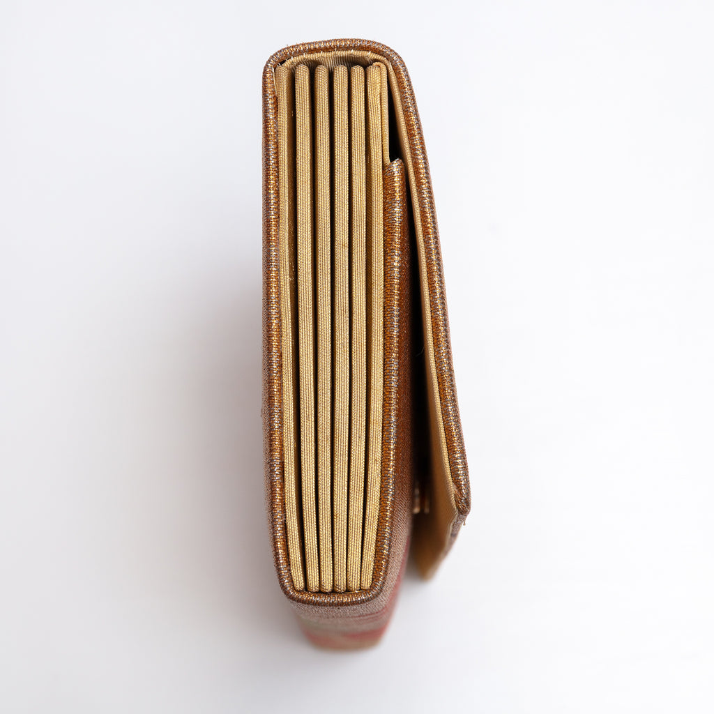 Side view of bronze-gold Japanese silk envelope clutch