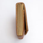Side view of bronze-gold Japanese silk envelope clutch