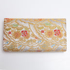 Back of silver and gold Japanese kimono silk envelope clutch with detailed woven pattern