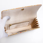 Cream silk interior with two pockets including zipped pocket inside vintage Japanese clutch, cream silk lining.