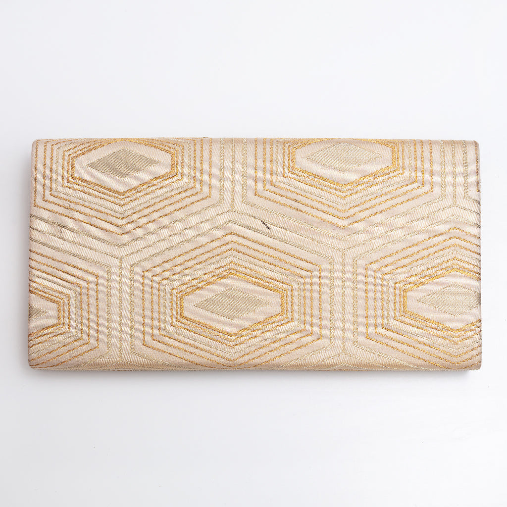 Back of pale gold Japanese silk foldover clutch with geometric woven design