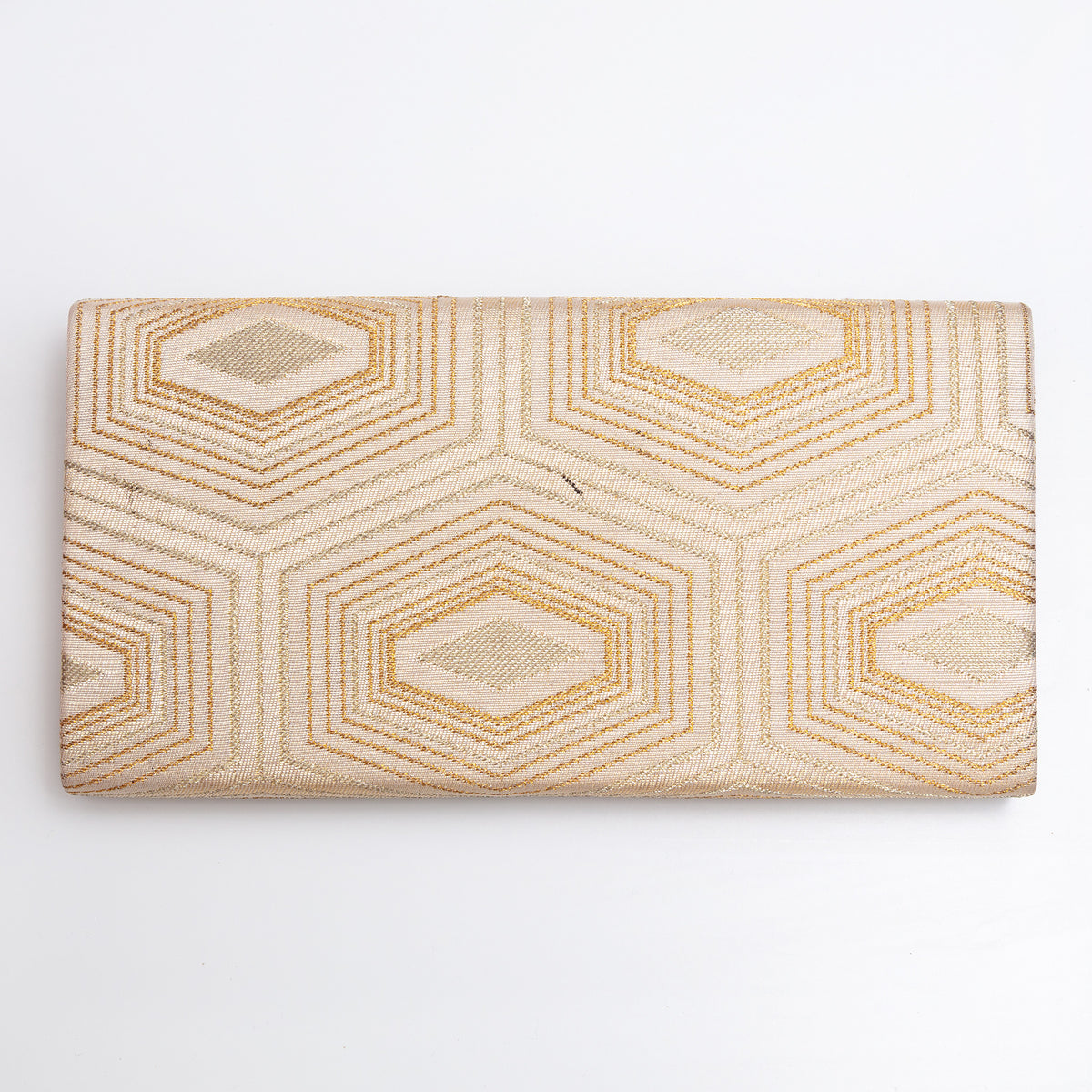 Back of pale gold Japanese silk foldover clutch with geometric woven design