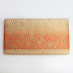 Gold and orange vintage Japanese silk foldover clutch with woven chrysanthemum motifs