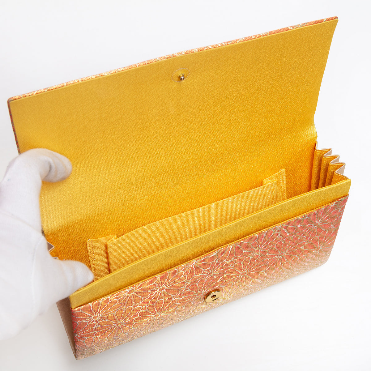 Butter silk interior with two pockets and two compartments inside vintage Japanese foldover clutch