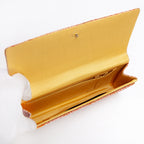 Butter silk interior with two pockets and two compartments inside vintage Japanese envelope clutch