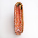 Side view of peach and silver Japanese silk envelope clutch