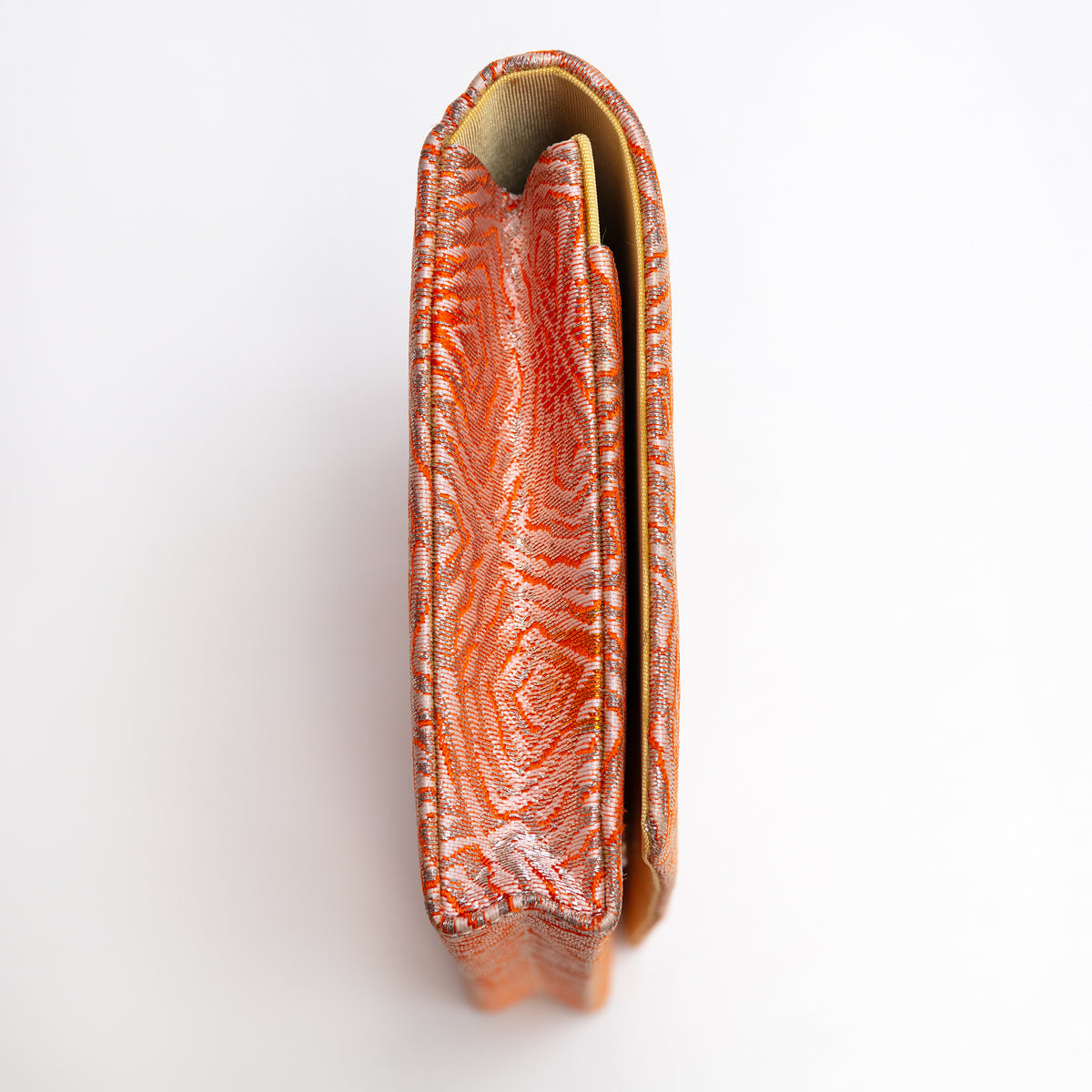 Side view of peach and silver Japanese silk envelope clutch