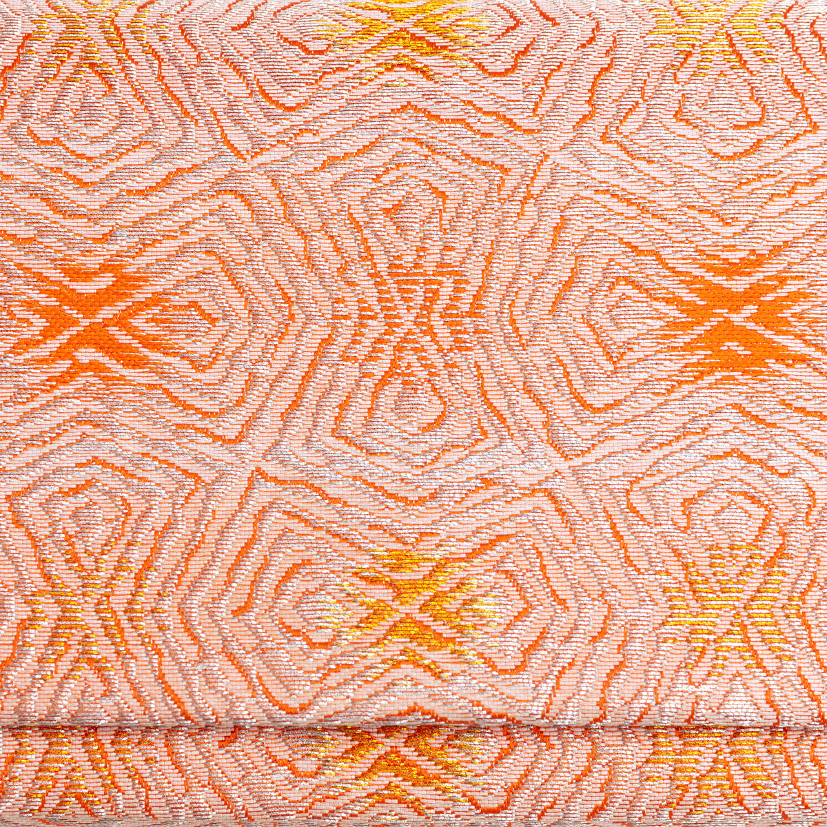 Close-up of peach, silver and gold abstract geometric weave in vintage Japanese kimono silk
