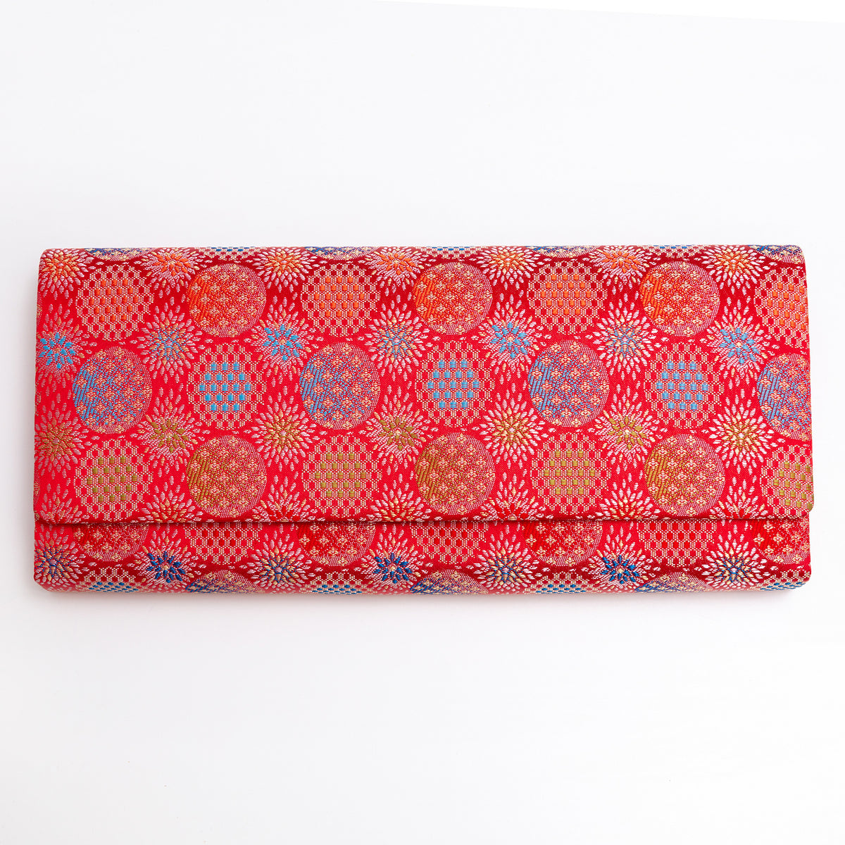 Vermilion red vintage Japanese silk envelope clutch with glowing circular and starburst motifs
