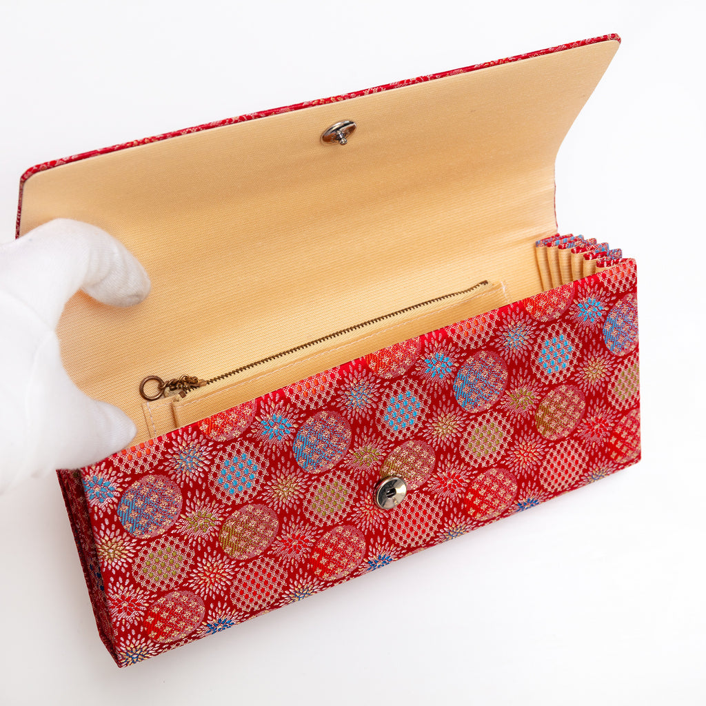 Cream twill silk interior with two pockets including zipped pocket inside vintage Japanese envelope clutch