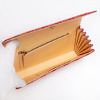 Cream twill silk interior with two pockets including zipped pocket inside vintage Japanese envelope clutch, showing the bottom interior of the bag