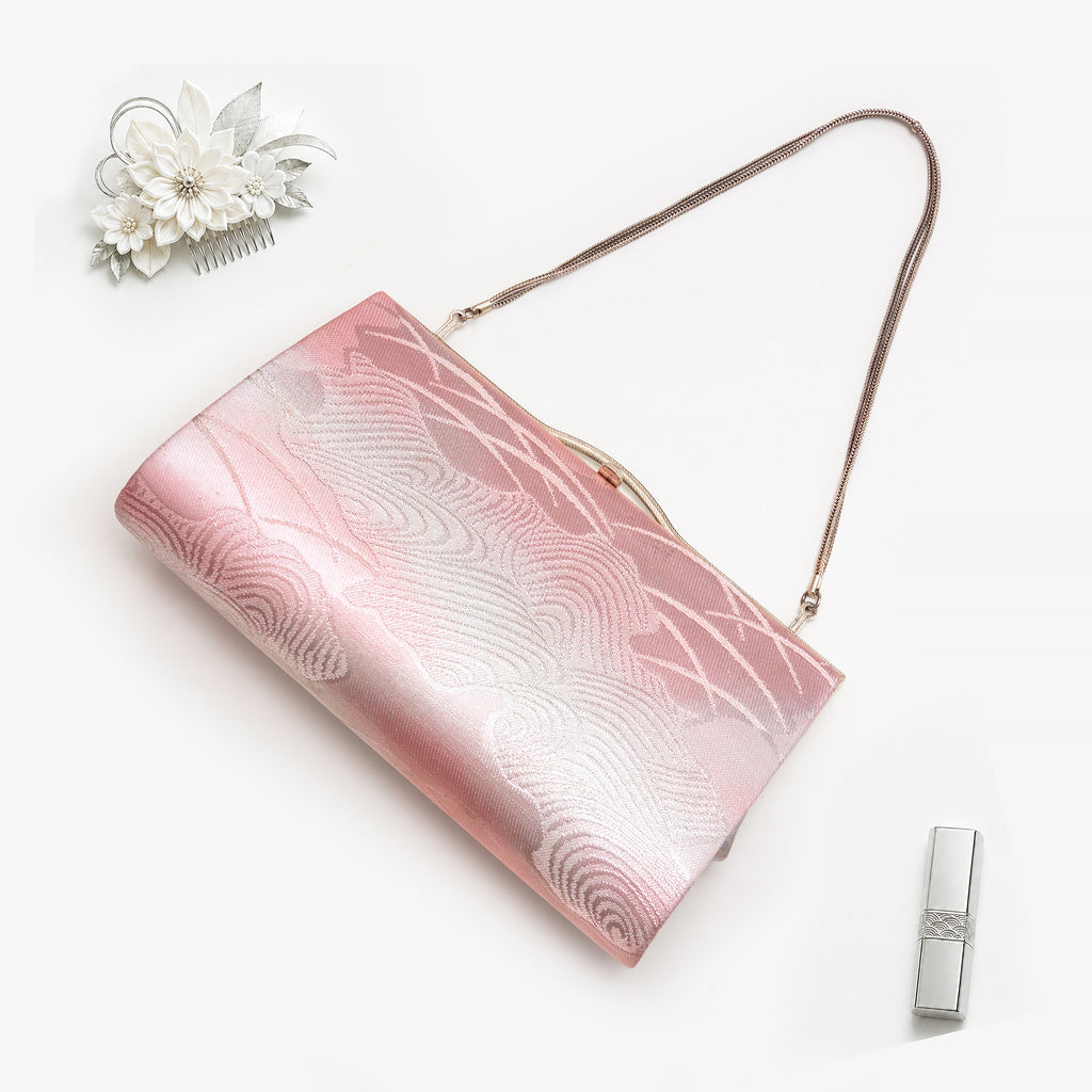 Pink and silver Japanese kimono silk clutch bag in styled flatlay