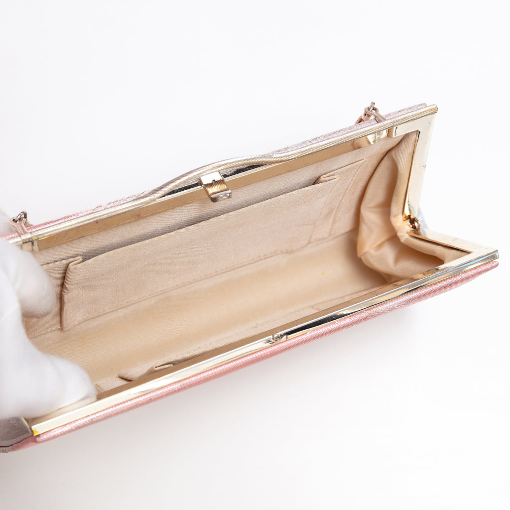 Pink silver kimono silk clutch with double chain hinges extended showing cream silk interior and pockets.