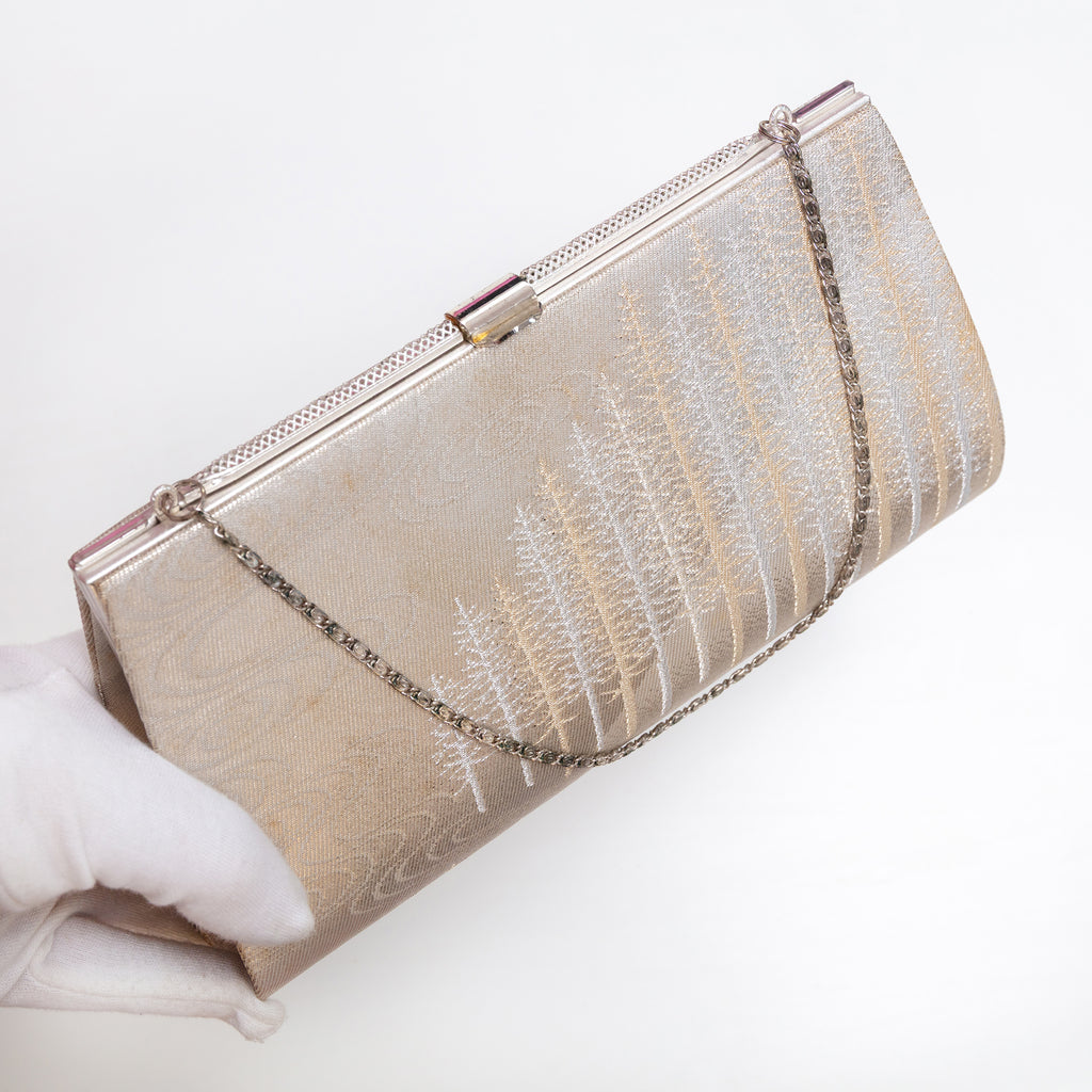 Pale gold Japanese kimono silk clutch bag shown at an angle