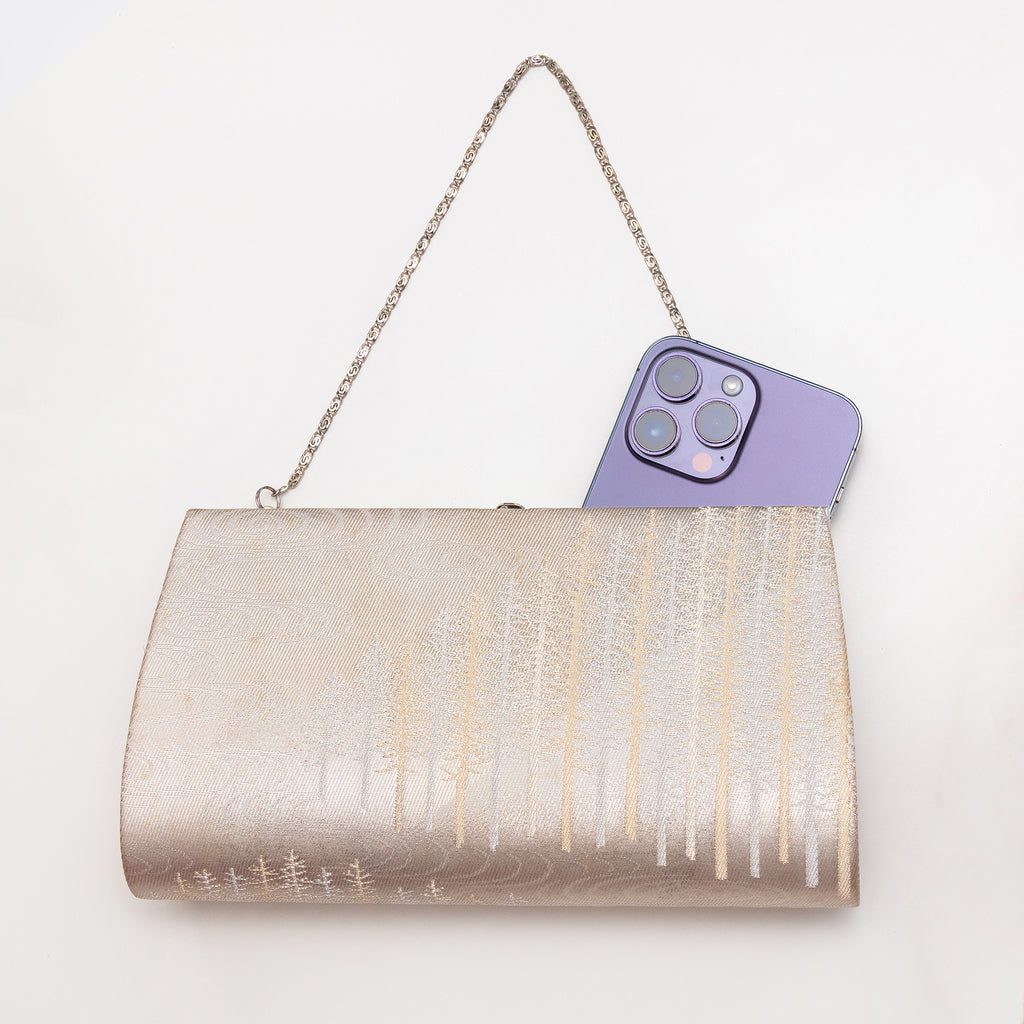 Vintage Japanese silk clutch bag shown with iPhone 14 Pro Max for scale