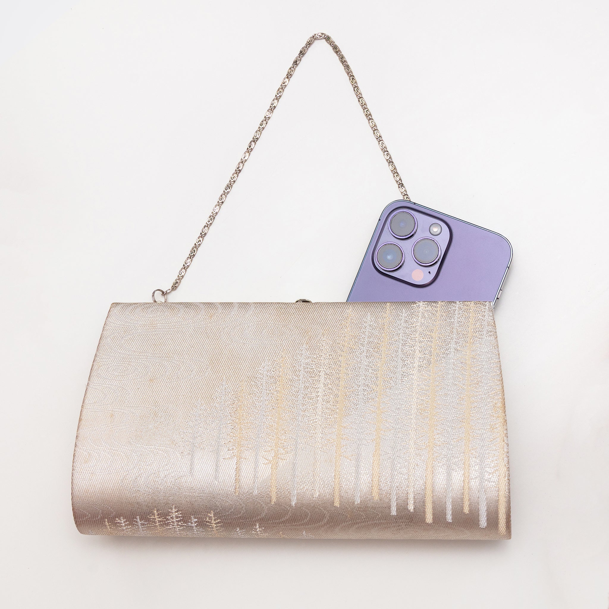 Vintage Japanese silk clutch bag shown with iPhone 14 Pro Max for scale