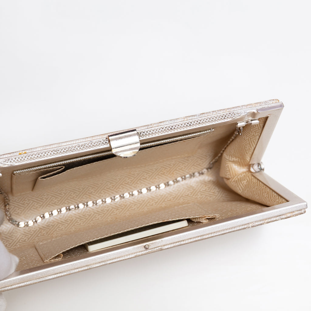 Pale gold silk clutch bag with chain tucked inside, original mirror