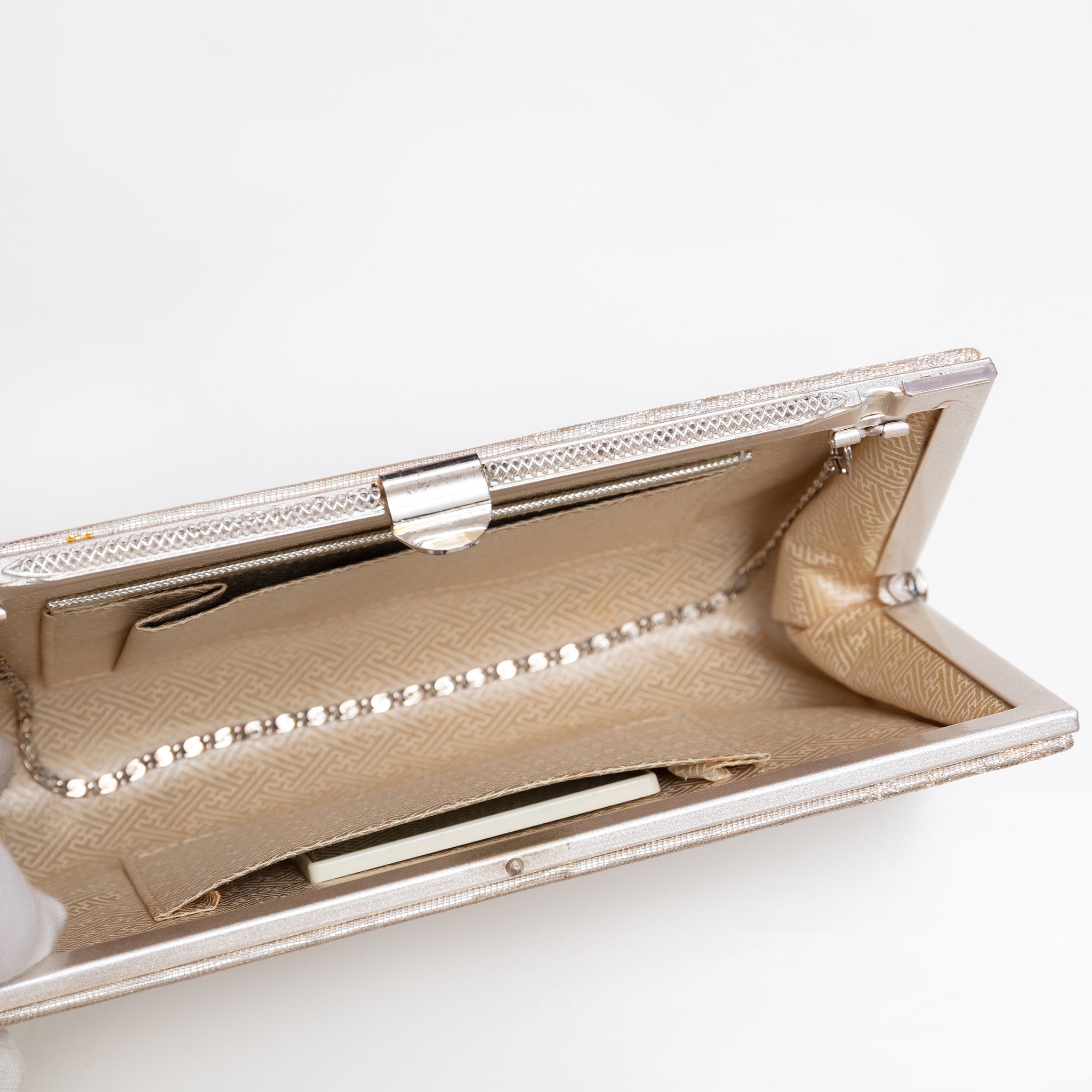 Pale gold silk clutch bag with chain tucked inside, original mirror