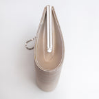 Pale gold vintage Japanese clutch view, side panel view.