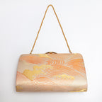 Orange and pale gold Japanese kimono silk clutch bag with wild wave design and gold chain strap
