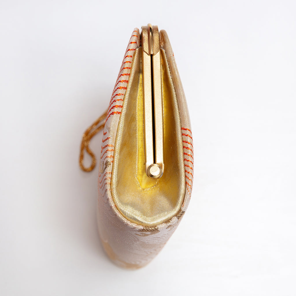 Side view of vintage Japanese kimono silk clutch bag with bright gold silk side panel
