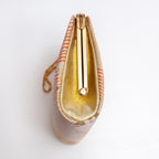 Side view of vintage Japanese kimono silk clutch bag with bright gold silk side panel