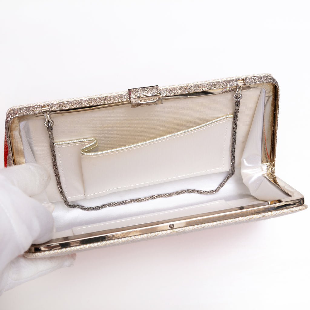 Open vintage Japanese silk clutch bag with silver-tone chain tucked inside