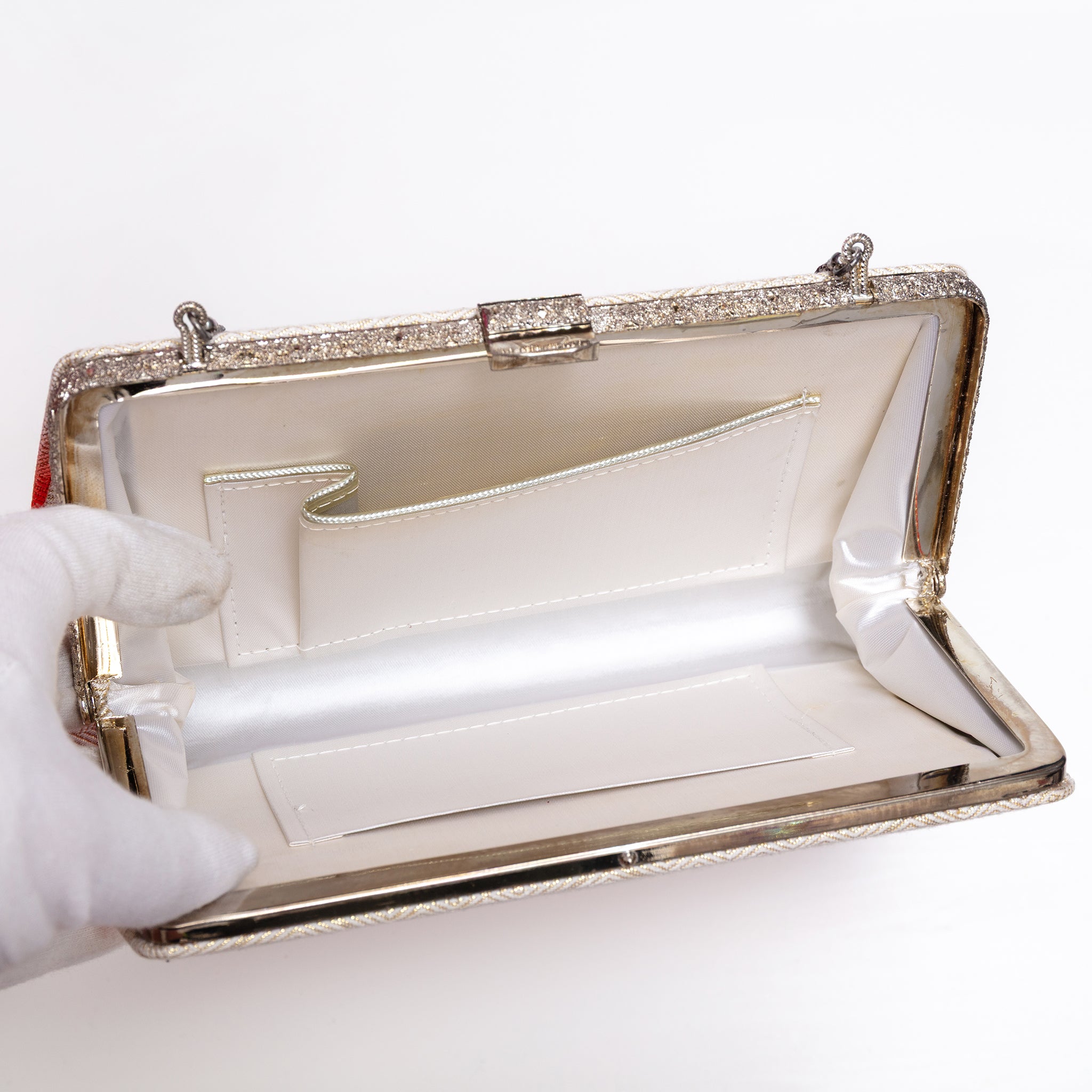 Open vintage Japanese silk clutch bag with silver-tone chain extended. White silk lining and two interior pockets