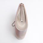 Side view of iridescent pink and silver Japanese kimono silk clutch bag featuring a silver metal frame clasp and a delicate silver chain strap, photographed from a top-down angle on a white background.