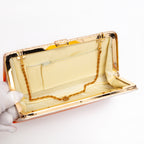 Open vintage Japanese silk clutch bag with gold-tone chain tucked inside