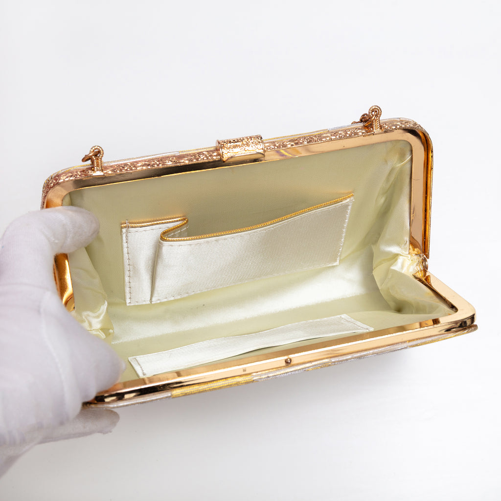 Open vintage Japanese silk clutch bag with chunky gold-tone chain extended. cream silk interior with gold trim pocket.