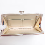 Open vintage Japanese silk clutch bag with silver-tone chain tucked inside, cream silk lining and 3 interior pockets.