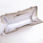 Open vintage Japanese silk clutch bag with silver-tone chain extended. White silk lining and internal pockets, one with a silver trim.