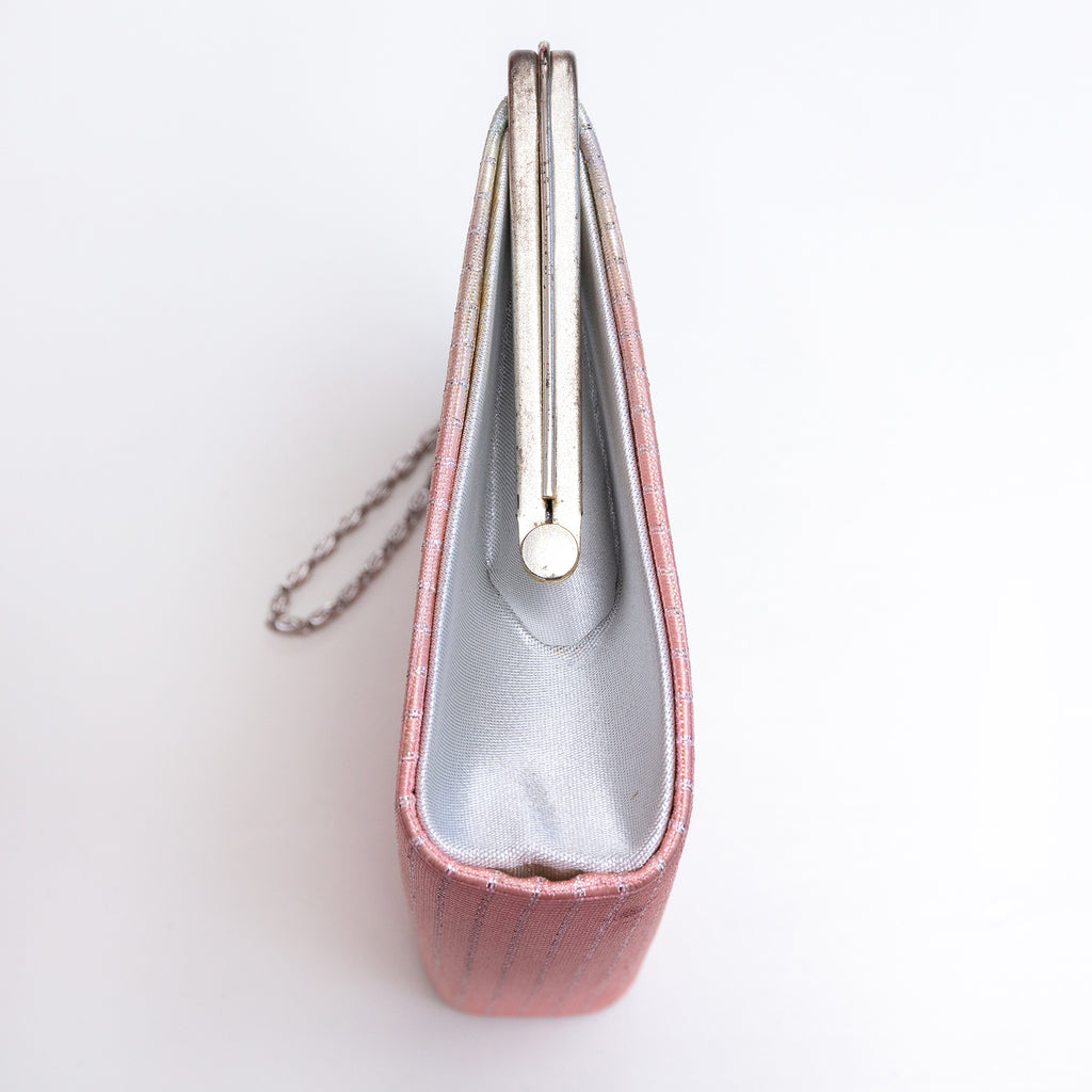 Side view of vintage Japanese clutch bag with plain silver metallic silk side panel