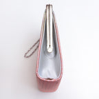 Side view of vintage Japanese clutch bag with plain silver metallic silk side panel