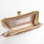 Open vintage Japanese silk clutch bag with gold-tone chain tucked inside, lined in beige twill silk, internal pockets.