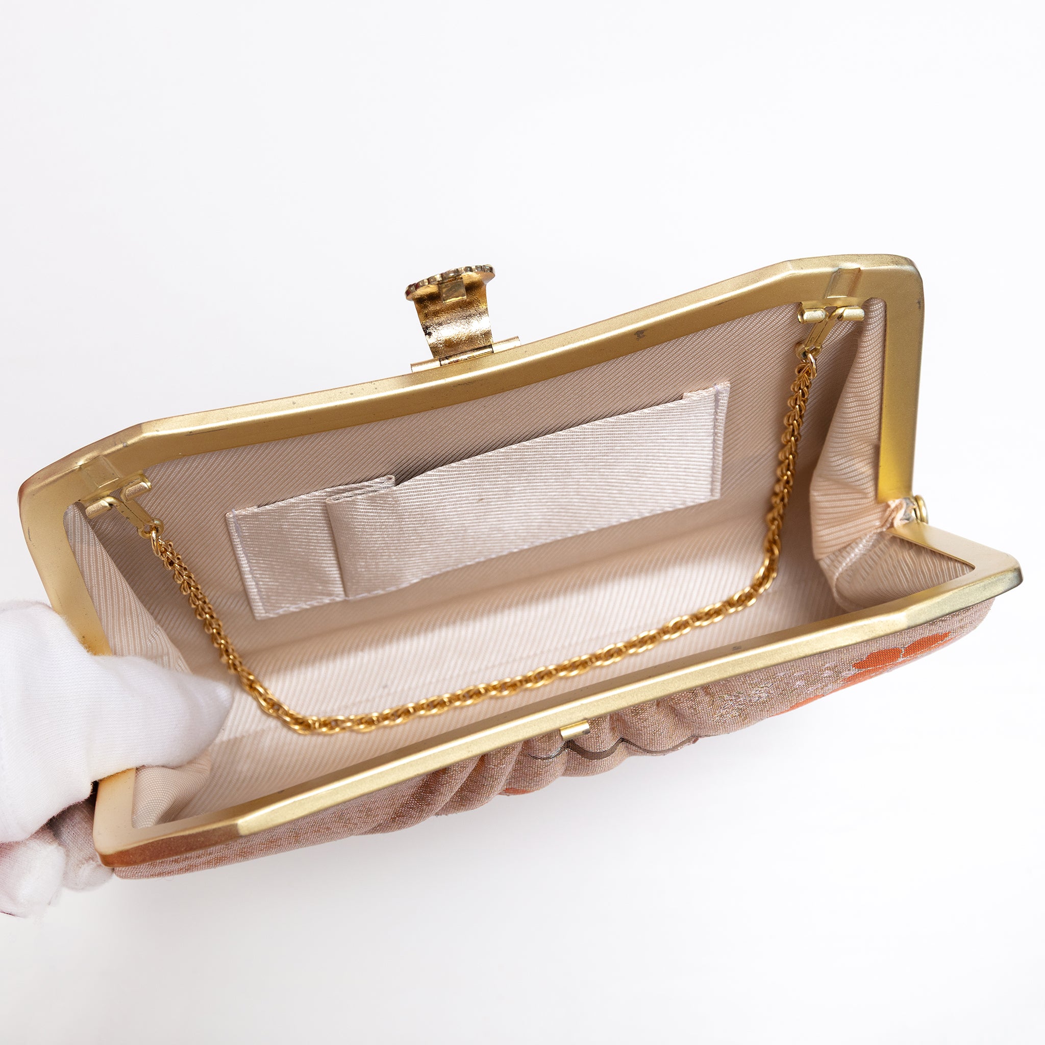 Open vintage Japanese silk clutch bag with gold-tone chain tucked inside, lined in beige twill silk, internal pockets.