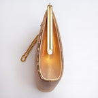 Side view of vintage Japanese clutch bag showing metallic woven gold silk panel