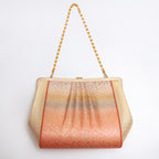 Back of metallic Japanese silk clutch bag with gathered abstract ombré design