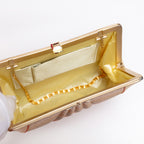 Open vintage Japanese silk clutch bag with gold-tone chain tucked inside