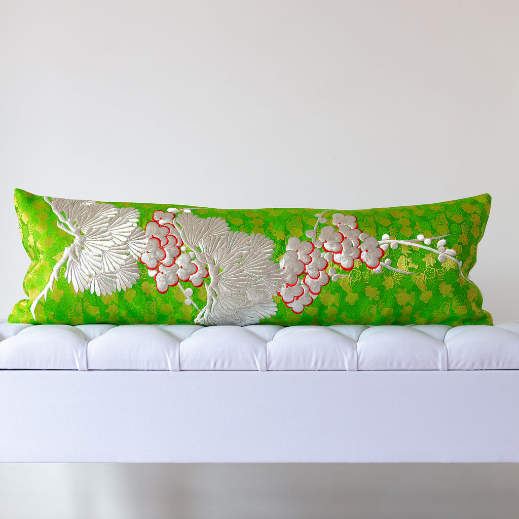 Green silk kimono bolster cushion with silver pine and blossom embroidery on metallic patterned silk