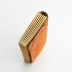 Side view of a vintage gold silk Japanese envelope clutch bag showing gold concertina style folded side panel.
