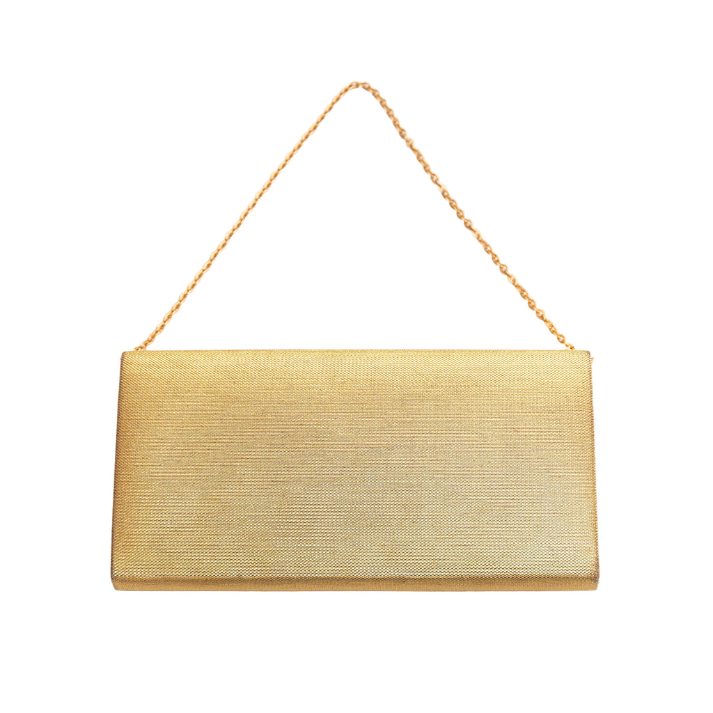 Reverse view of a vintage Japanese gold clutch bag with gold metal strap on a white background.