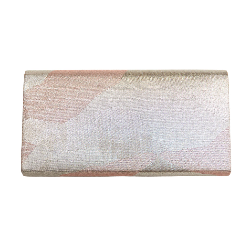 Reverse view of vintage Japanese silk fold over clutch bag in silver with geometric pattern on white. 